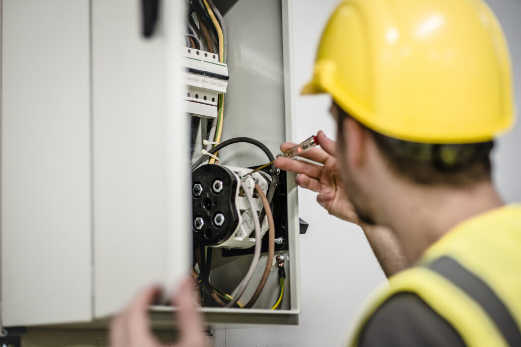 Electrician repairing electric panel. Main Electrical Panel