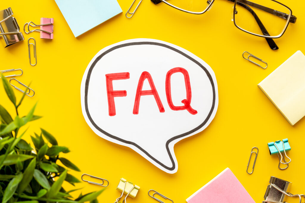 Faq - frequently asked questions - on office table, top view. Electrical Inspections