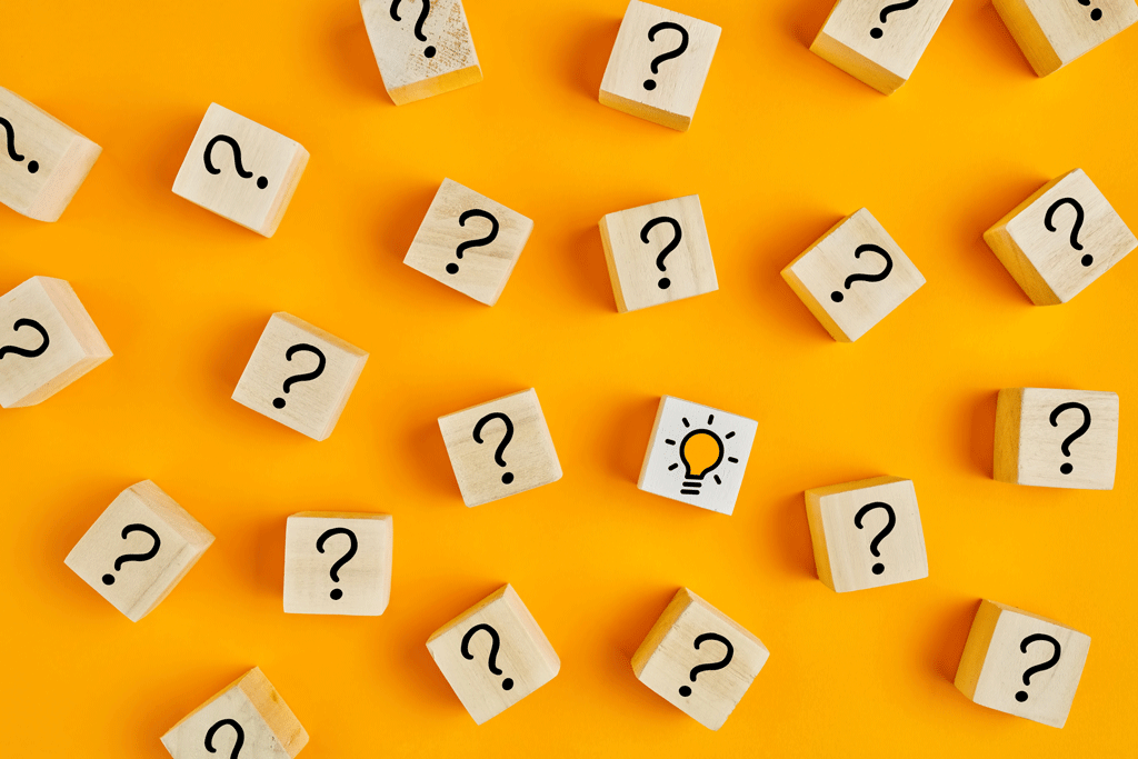 multiple question marks and a light bulb on orange background | emergency electrician wilmington nc 