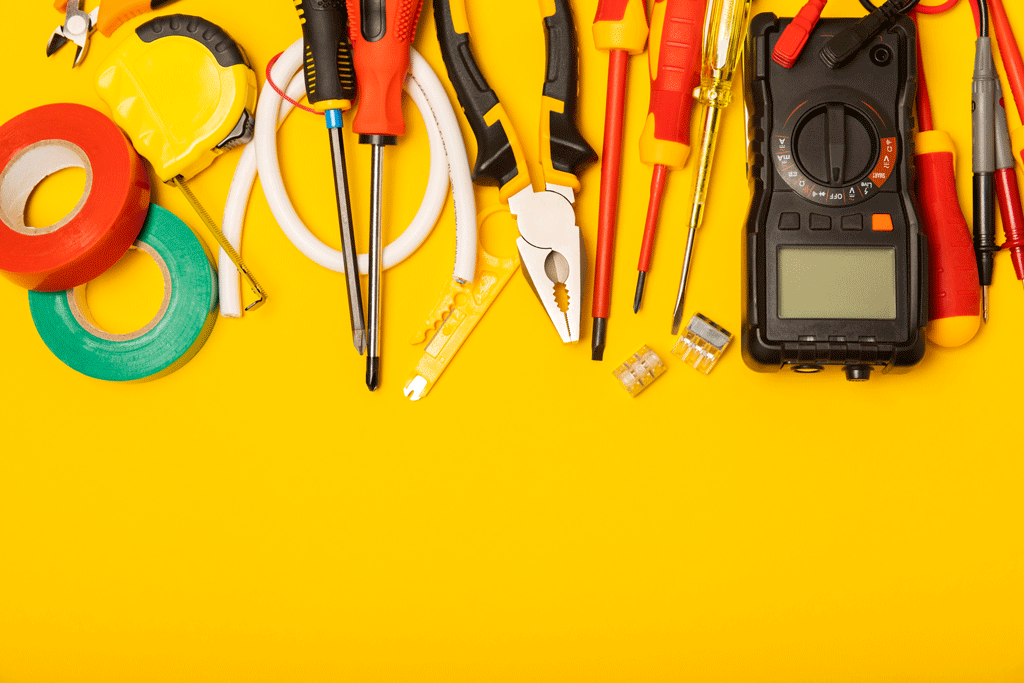 different electrical tools on a yellow background electrical repair wilmington nc